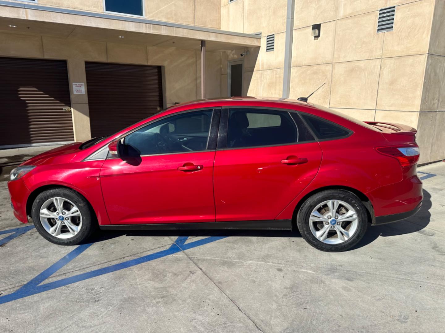 2012 RED /BLACK Ford Focus SE Sedan (1FAHP3F29CL) with an 2.0L L4 DOHC 16V engine, AUTOMATIC transmission, located at 30 S. Berkeley Avenue, Pasadena, CA, 91107, (626) 248-7567, 34.145447, -118.109398 - New Tires! Nice Interior! drives and looks good! Bad credit? We can help! We are the bank. All our cars are thoroughly inspected and reconditioned by our technicians. FREE CARFAX report. Stop by or call to speak with our friendly staff. Whether you have bad credit, no credit, bankruptcy, or reposse - Photo#1